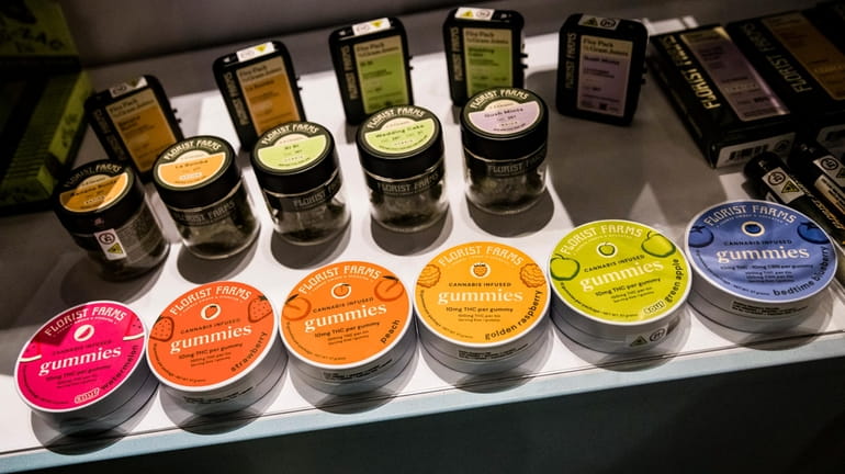Flavored cannabis gummies are displayed in a cabinet at the...