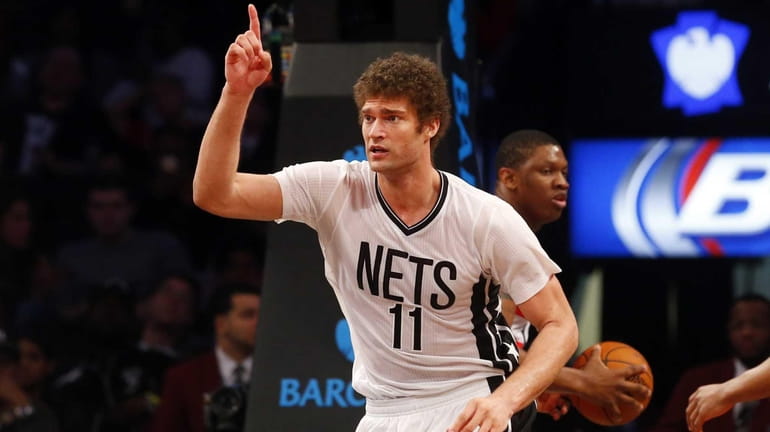 Brook Lopez of the Brooklyn Nets reacts after a basket...
