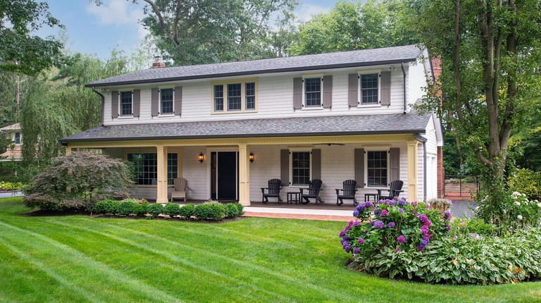 Priced at $1.199 million, this in Colonial on Pegs Lane features a...