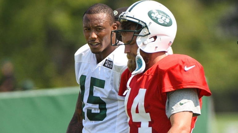 New York Jets wide receiver Brandon Marshall (15) and New...