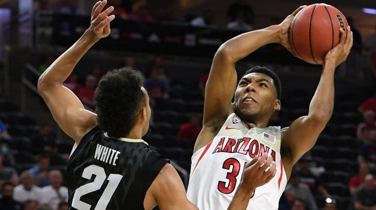 Allonzo Trier of Arizona goes to the basket against Derrick...