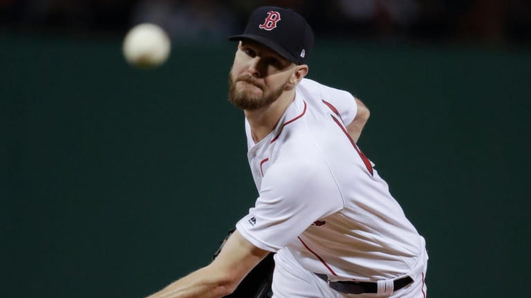 Boston Red Sox starting pitcher Chris Sale throws during the...