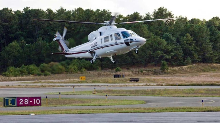 Helicopters arriving and departing at the East Hampton Town Airport...