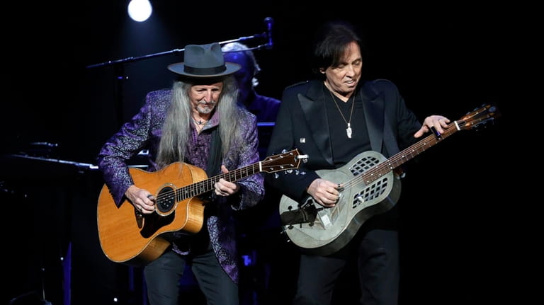Patrick Simmons and John McFee of The Doobie Brothers perform...