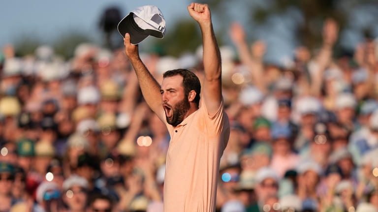 Scottie Scheffler celebrates his win at the Masters golf tournament...