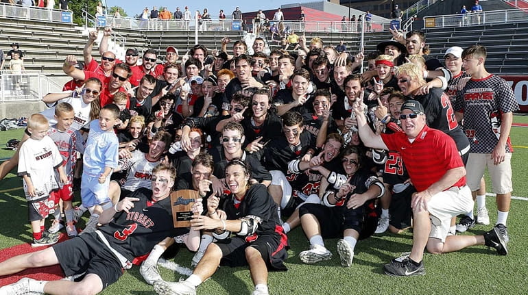 The Syosset Braves boys lacrosse team poses with its new...