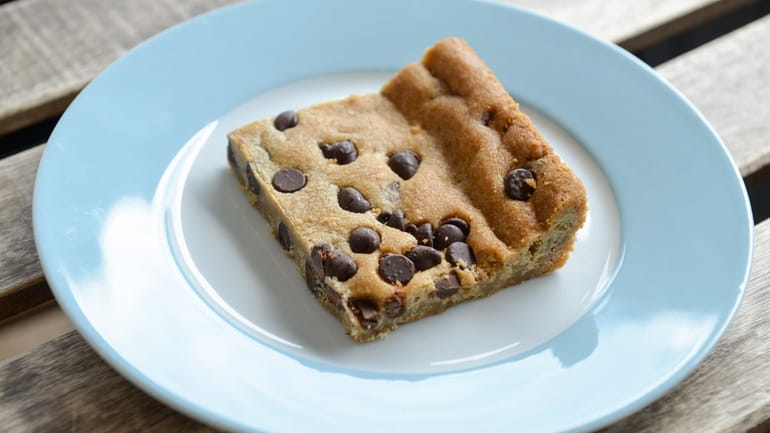 A classic vegan blondie with chocolate chips at Sweet to...