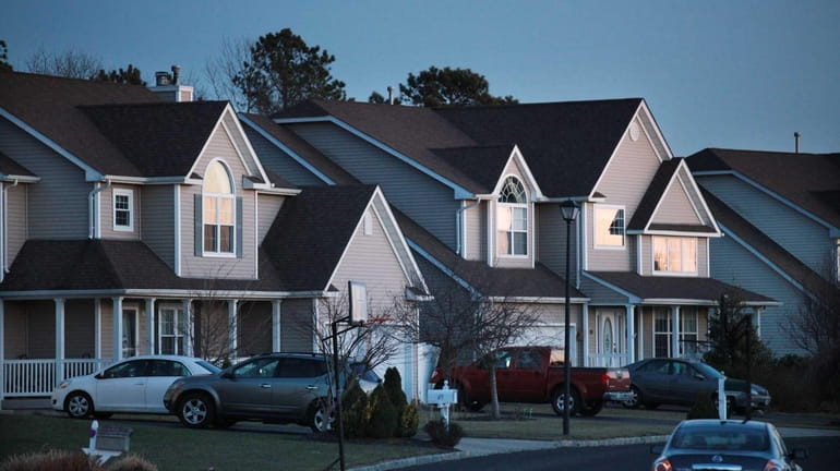 Houses line a street in a Manorville subdivision. (Jan. 10,...