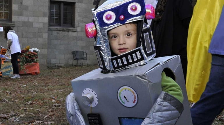 Lorenzo Coumo, 3, of Islip as a robot for the...