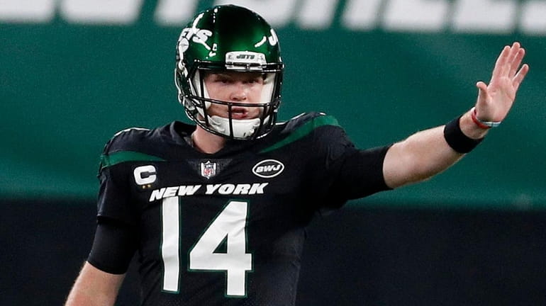 Sam Darnold #14 of the New York Jets prepares for...