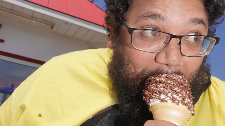 Shazar Kanhai of Valley Stream enjoys his ice cream at...
