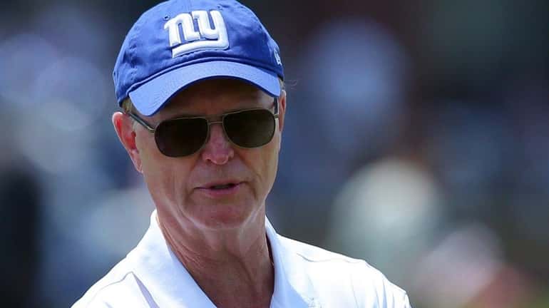 Giants co-owner John Mara on the field during training camp...