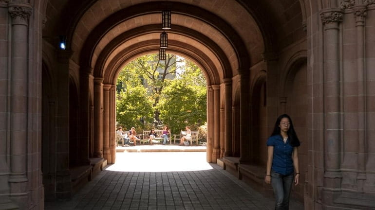A student at Yale University walks on campus. (Sept. 14,...