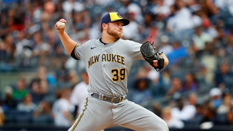 FILE -Milwaukee Brewers starting pitcher Corbin Burnes (39) throws against...
