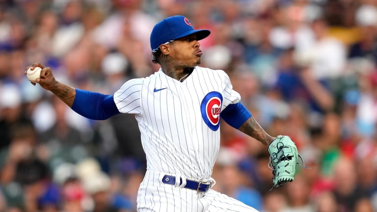 Chicago Cubs starting pitcher Marcus Stroman delivers during the first...