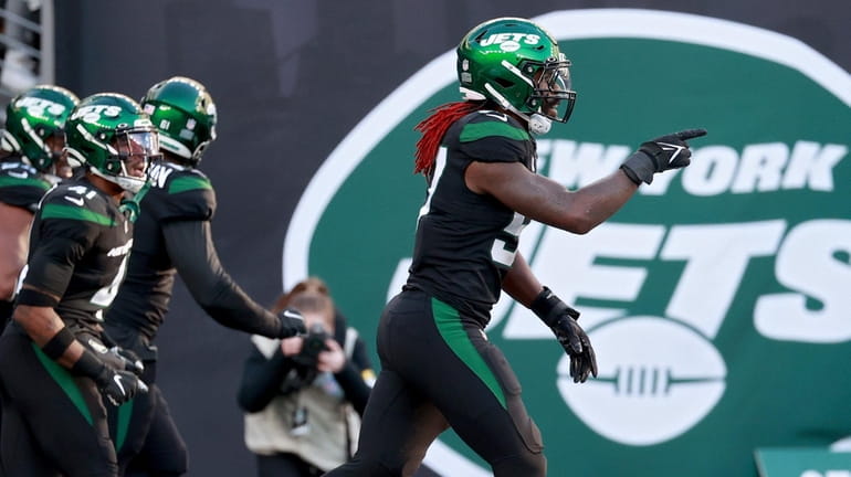 C.J. Mosley #57 of the Jets celebrates after forcing a fumble...