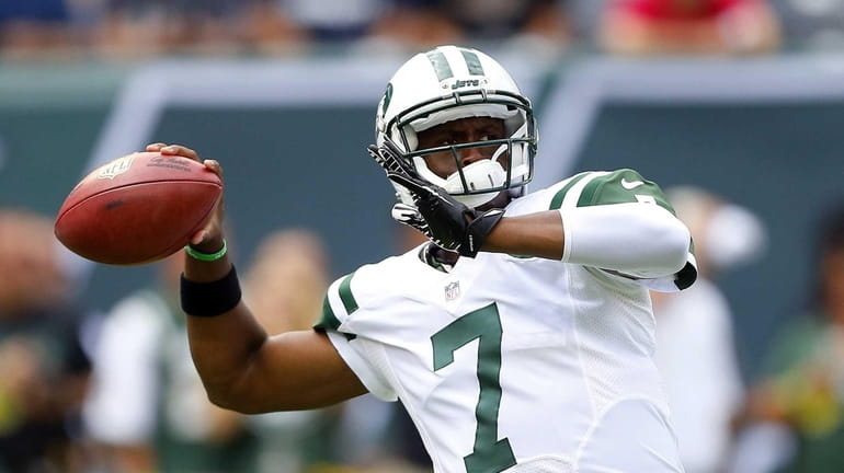 Geno Smith warms up before a game against the Tampa...