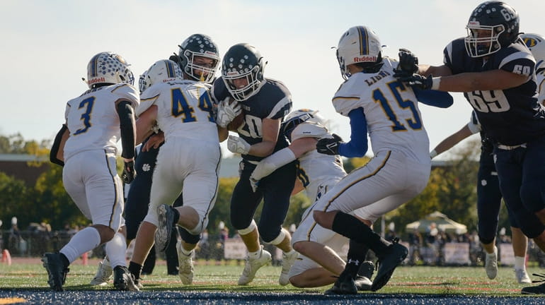 Jackson Campbell of Northport (20) pushes through the West Islip...