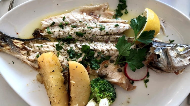 Grilled whole branzino with lemon and herbs at Limani Grille...