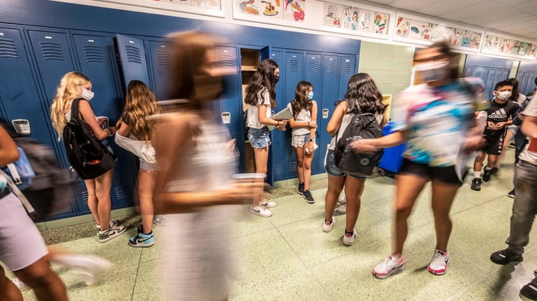 Middle and high school students return to class on the...