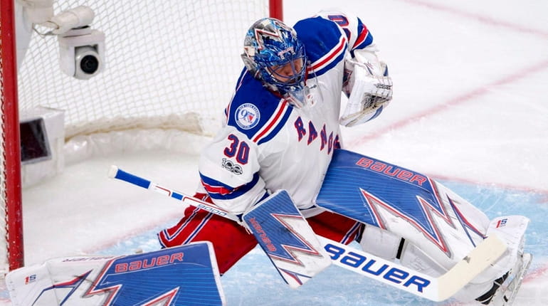 New York Rangers goalie Henrik Lundqvist (30) makes a save...
