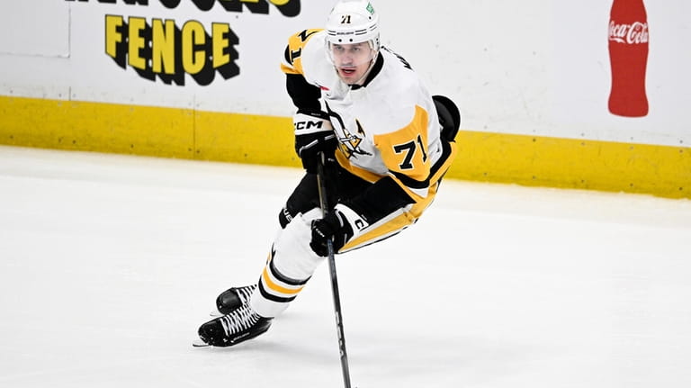 Pittsburgh Penguins center Evgeni Malkin skates with the puck during...