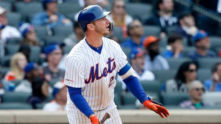 Pete Alonso of the Mets follows through on his seventh-inning,...