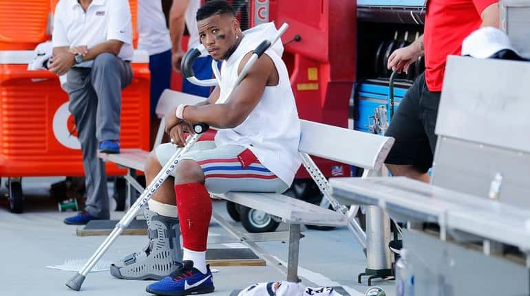 Saquon Barkley of the New York Giants on the bench...