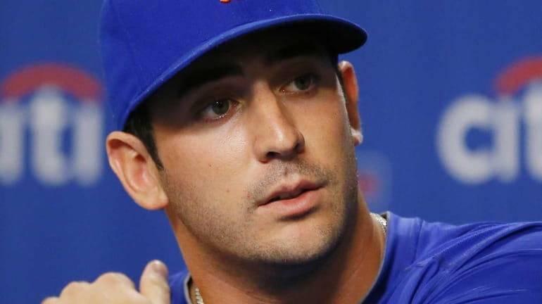 Matt Harvey speaks during a news conference announcing that he...