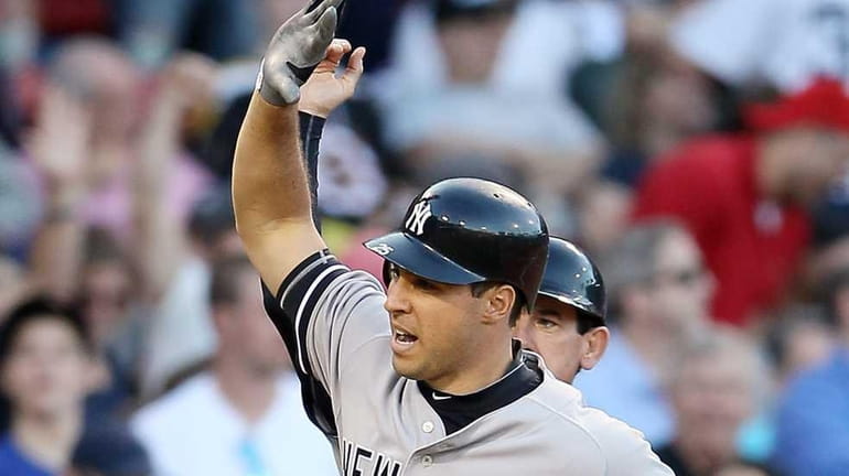 Mark Teixeira of the New York Yankees heads for home...