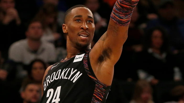 The Nets' Rondae Hollis-Jefferson follows through on a three-point basket in...