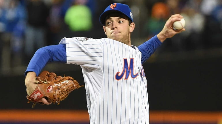 New York Mets starting pitcher Steven Matz (32) delivers the...