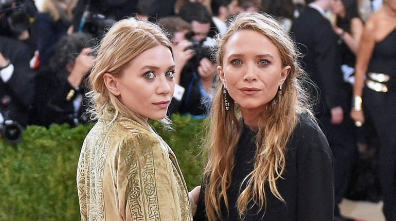 Mary-Kate Olsen, right, with her sister Ashley Olsen, has opened...