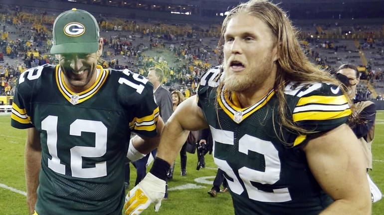 Green Bay Packers' Aaron Rodgers (12) and Clay Matthews celebrate...
