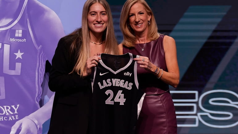 Iowa's Kate Martin, left, poses for a photo with WNBA...