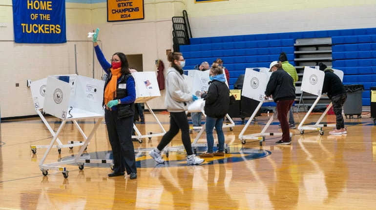 Voters cast their vote at Mattituck-Cutchogue Jr. Sr. High School...