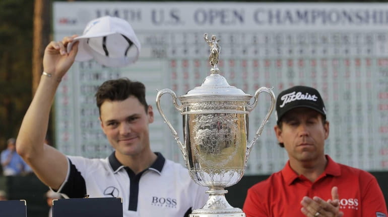 Martin Kaymer, of Germany, left, and Erik Compton pose with...