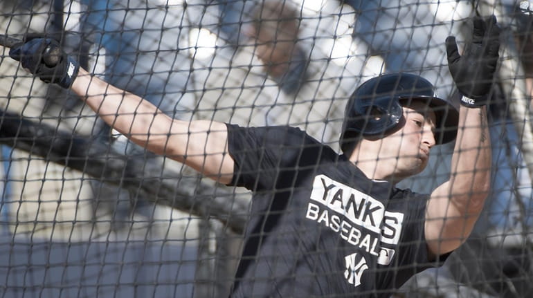 New York Yankees' Tyler Wade in mid-swing during batting practice...