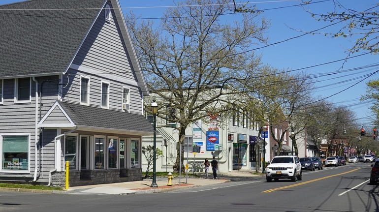Businesses and houses on Main Street in Islip