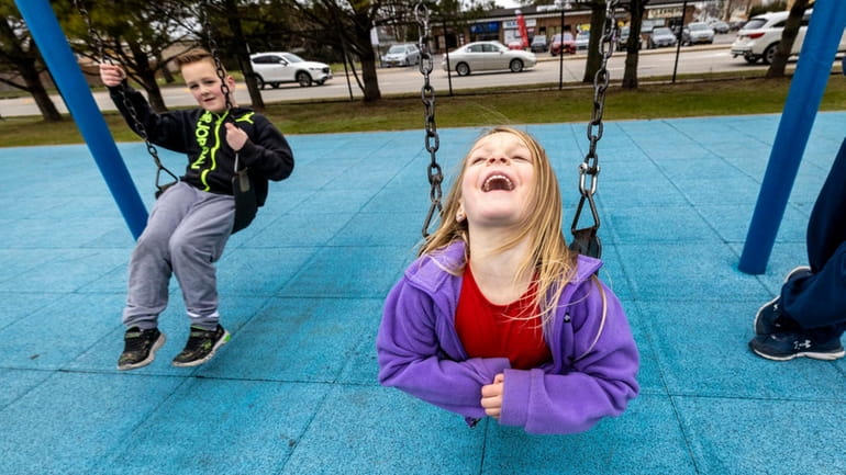 Isabella Smith, 4, and her brother Aidan, 7, having fun...