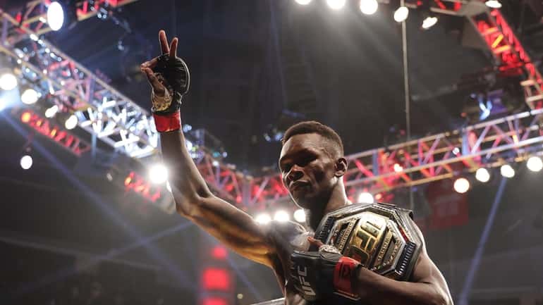  Israel Adesanya celebrates after defending his middleweight championship against Robert...
