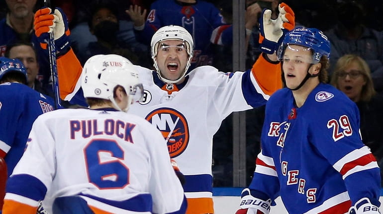 Kyle Palmieri of the Islanders celebrates his third-period goal against the Rangers...