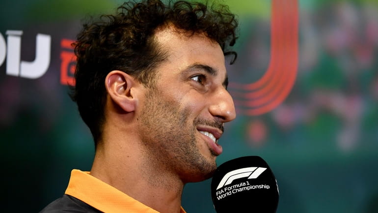McLaren driver Daniel Ricciardo of Australia attends a news conference...
