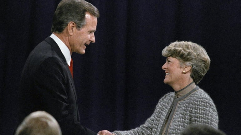 Then-Vice President George H.W. Bush shakes hands with Democratic vice...