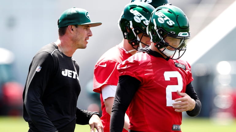 Jets quarterbacks coach Rob Calabrese works players during OTAs held at...