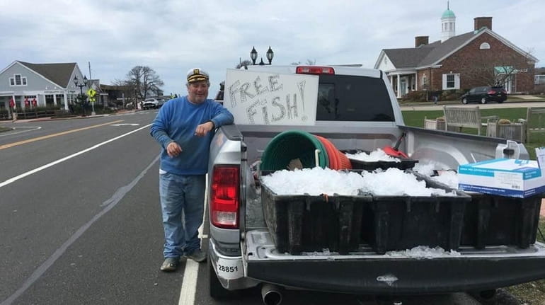 Chucky Morici of Montauk gives away fish he caught.