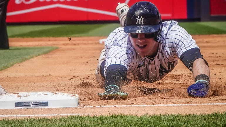 Yankees' Harrison Bader returns safe to first base after attempting...