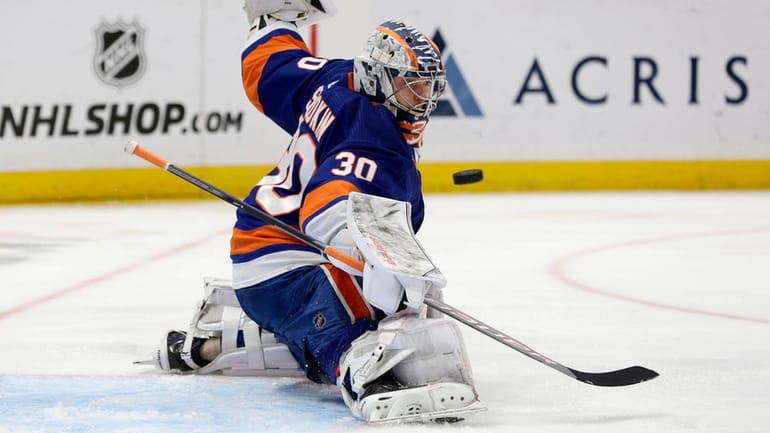 Ilya Sorokin of the New York Islanders makes a save during...