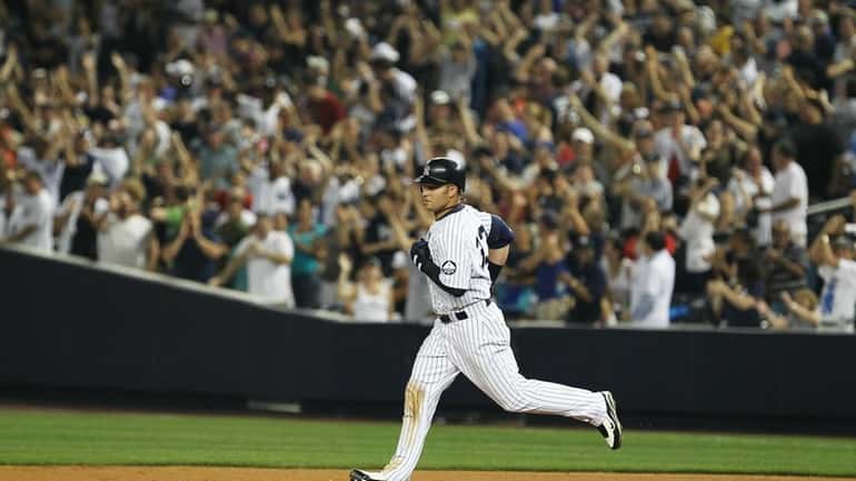 Nick Swisher of the New York Yankees rounds the bases...