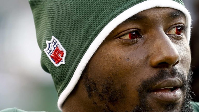 Jets wide receiver Santonio Holmes looks on during the game...